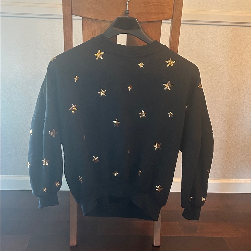 Black Sweater with Gold Star Accents